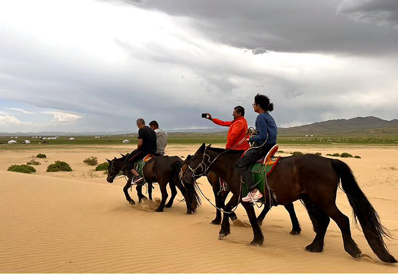 Horse riding in Mongolia sand dune